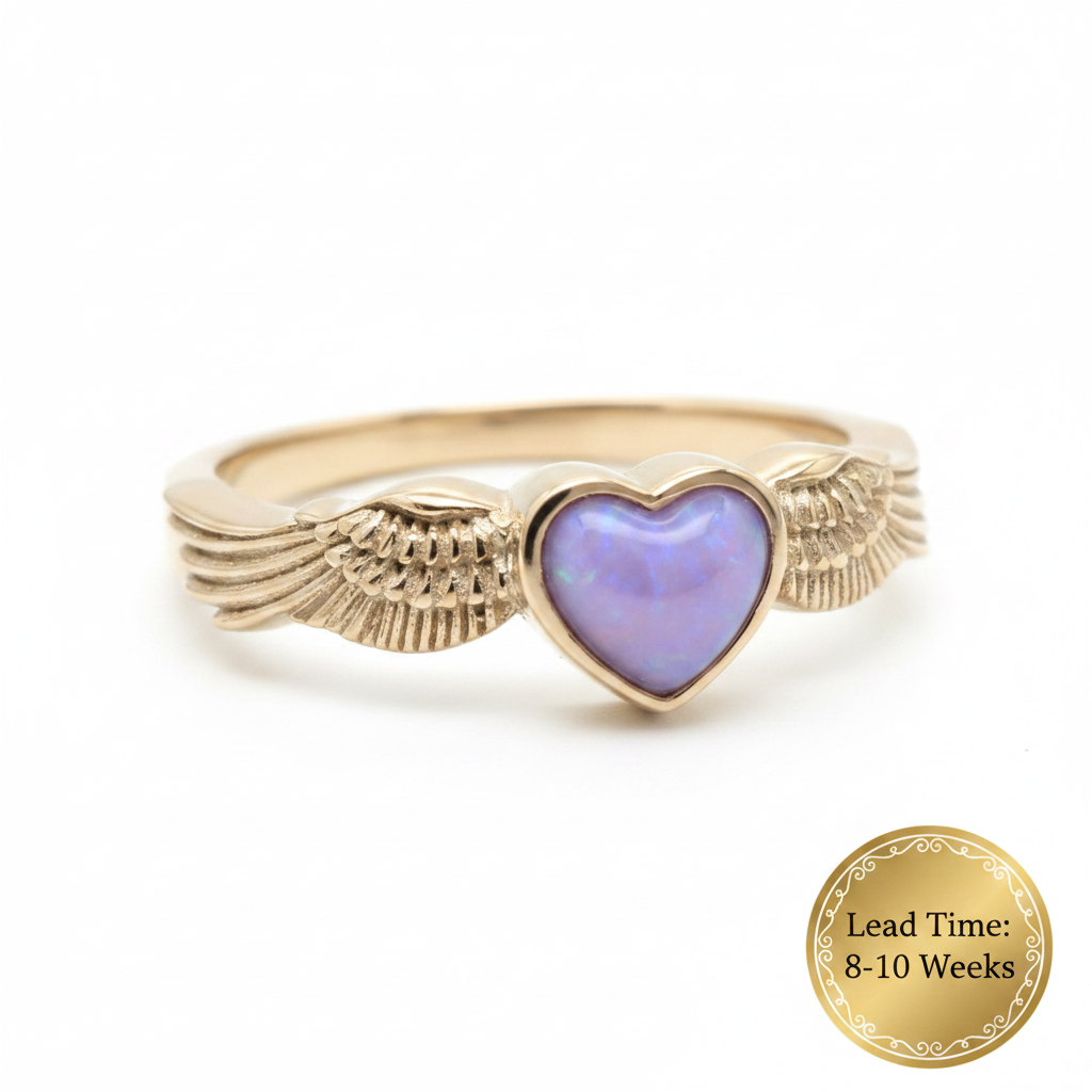 9ct gold heart angel wing ring with lavender opal resin in heart bezel, white background, lead time 8-10 weeks sticker