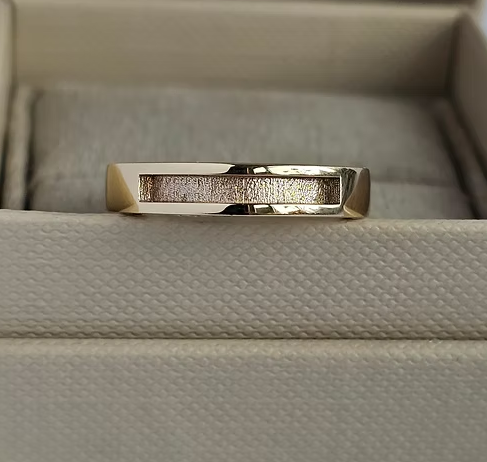 9ct yellow gold 4mm square front face channel band ring front-on view in jewellery box showing squared edge bezel and channel