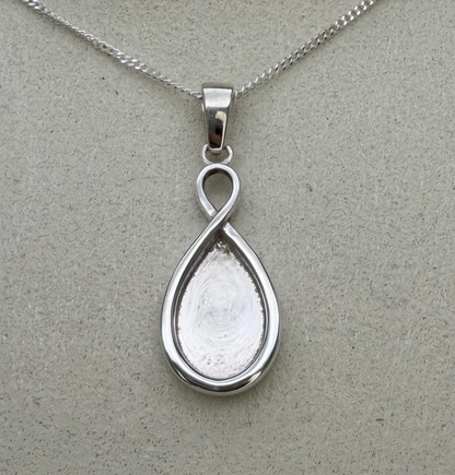 925 sterling silver infinity teardrop pendant close-up showing infinity loop detail and deep teardrop bezel recess ready for resin