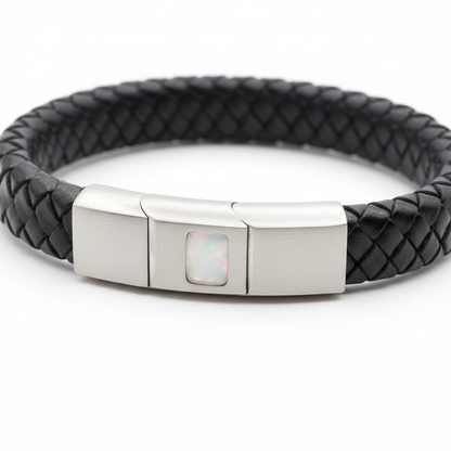Black leather memorial bracelet with white pearl opal shimmer resin in stainless steel clasp recess on white background