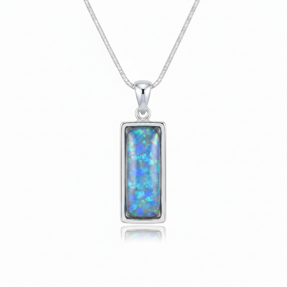 Silver 925 rectangular bar memorial pendant with blue opal resin on chain, white background
