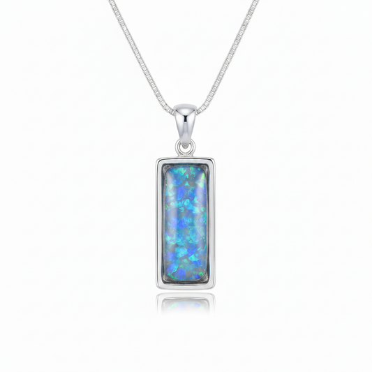 Silver 925 rectangular bar memorial pendant with blue opal resin on chain, white background