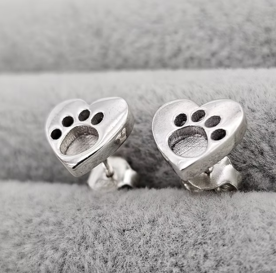 Silver 925 heart paw print stud earrings close up on grey velvet — blank silver