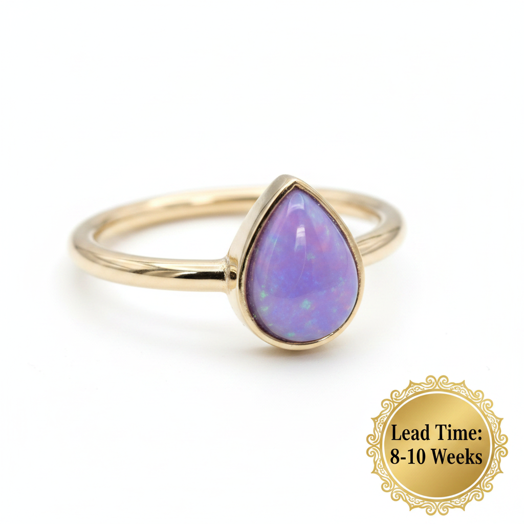 9ct gold plain teardrop ring with lavender opal resin in pear bezel, white background, lead time 8-10 weeks sticker