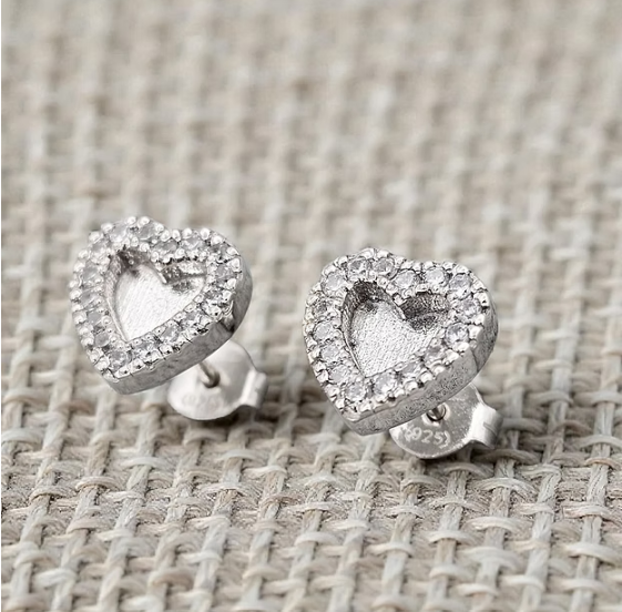 Silver 925 heart CZ halo stud earrings on woven fabric — blank silver