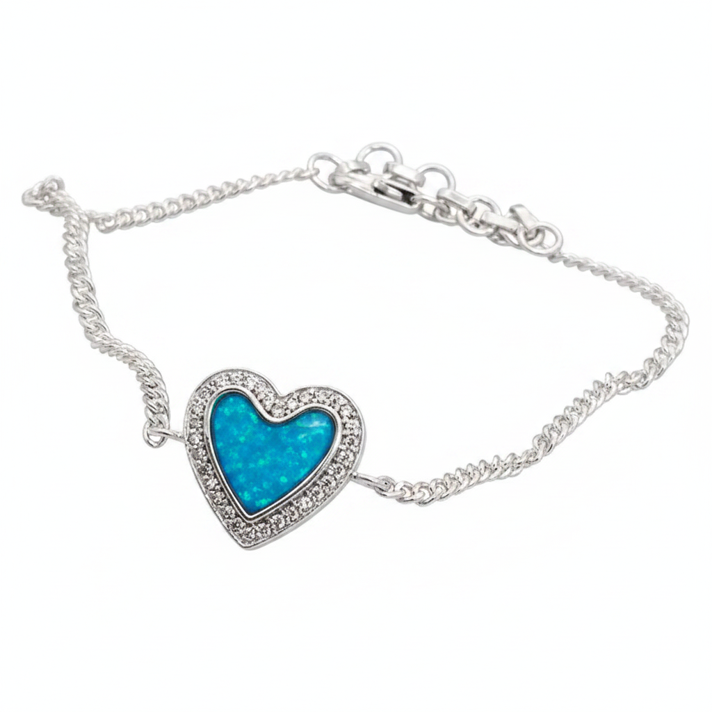 Heart CZ silver curb chain bracelet close-up macro with blue teal opal resin in CZ halo heart bezel, white background