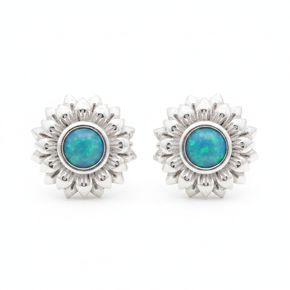 Silver 925 sunflower stud earrings — blue teal opal resin centre, white background