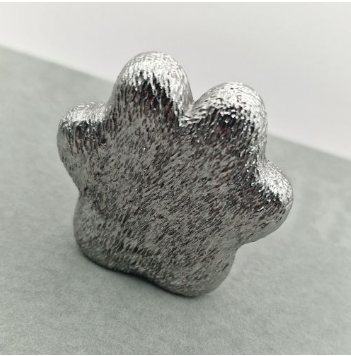 Chrome mirror-polished stainless steel paw print memorial ornament rear view showing textured fur finish