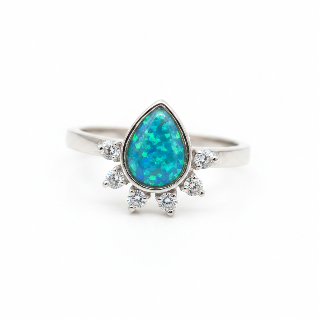 Rain drop CZ 925 silver ring with blue teal opal resin pear centre on white background