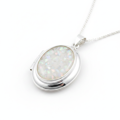 Silver 925 oval hinged locket with white pearl opal resin in 18x13mm setting on white background