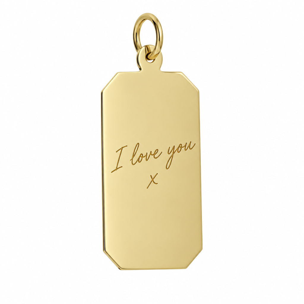 Illustrative handwriting engraving on plain 9ct yellow gold rectangular pendant alone against white