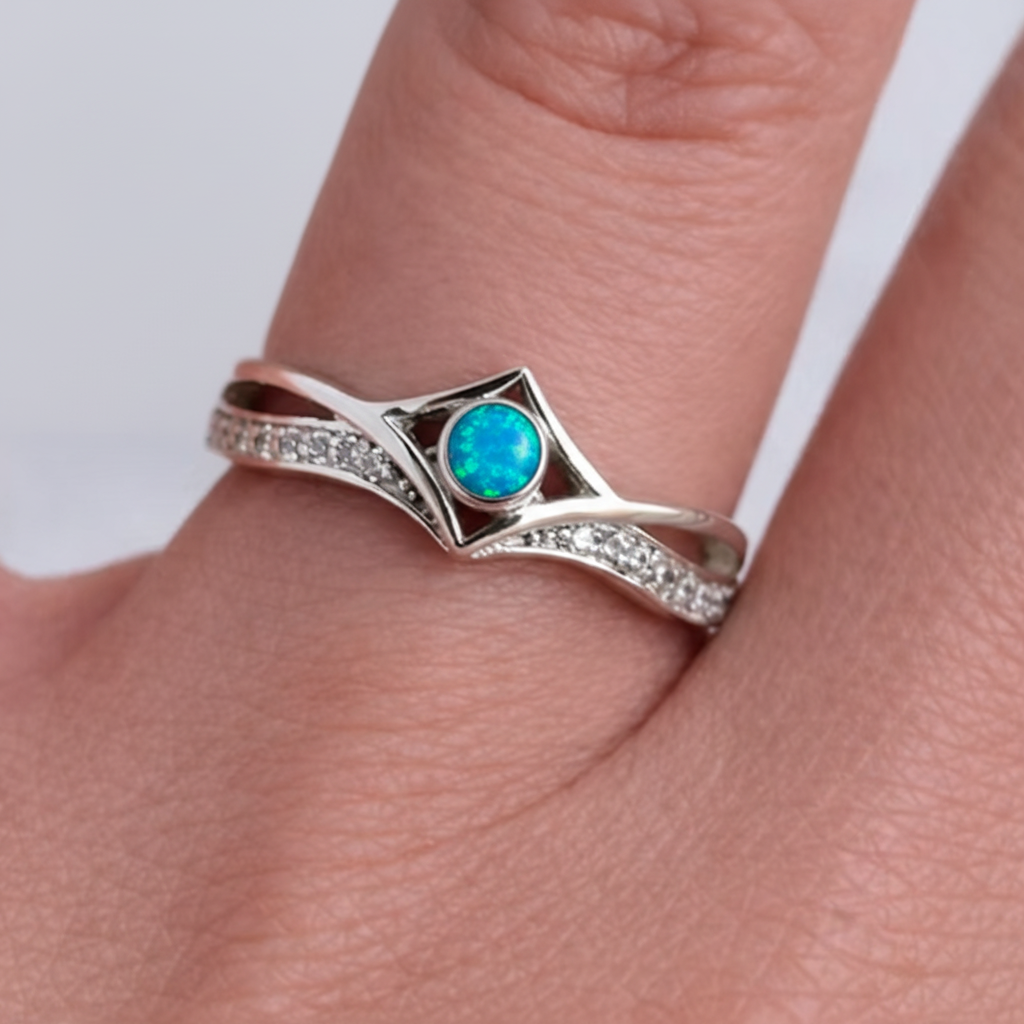 Silver 925 CZ inverted wishbone ring with blue teal opal resin worn on finger lifestyle memorial jewellery shot