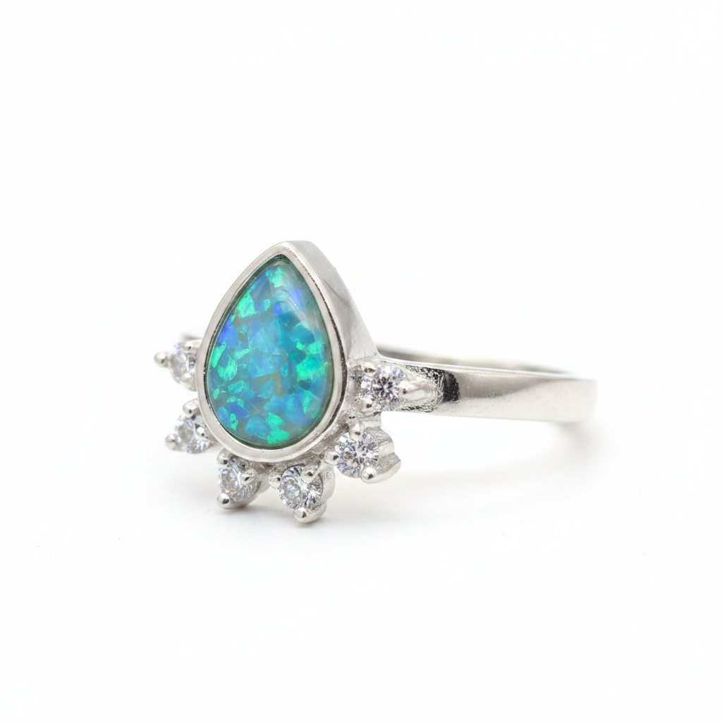 Rain drop CZ 925 silver ring with blue teal opal resin side profile view on white background