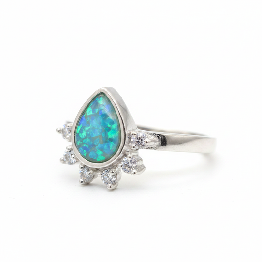 Rain drop CZ 925 silver ring with blue teal opal resin side profile view on white background