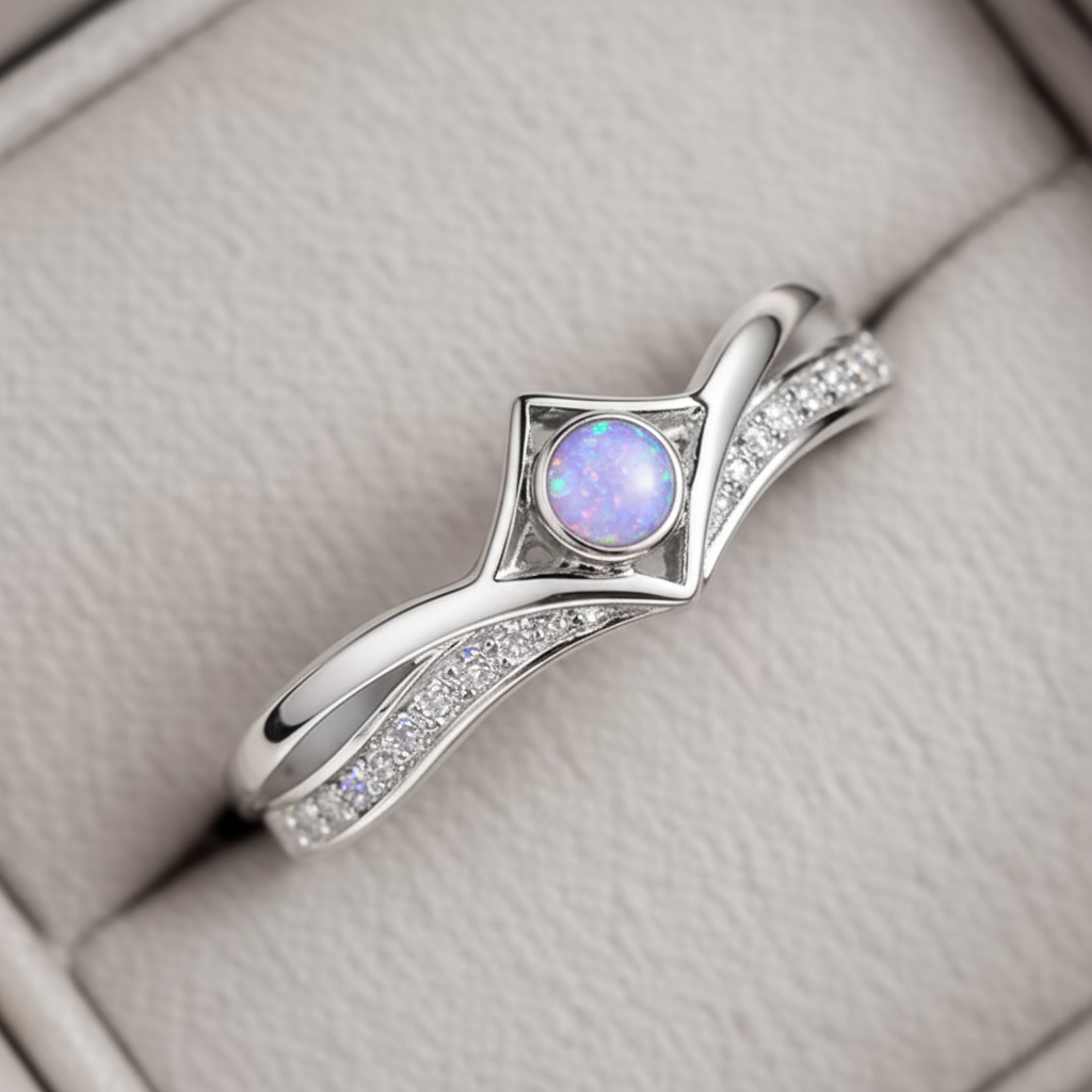Silver 925 CZ inverted wishbone ring with lavender purple opal resin in 4mm central setting on white background