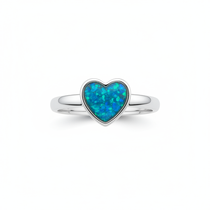 925 sterling silver plain heart memorial ring with blue teal opal resin filling heart bezel on white background