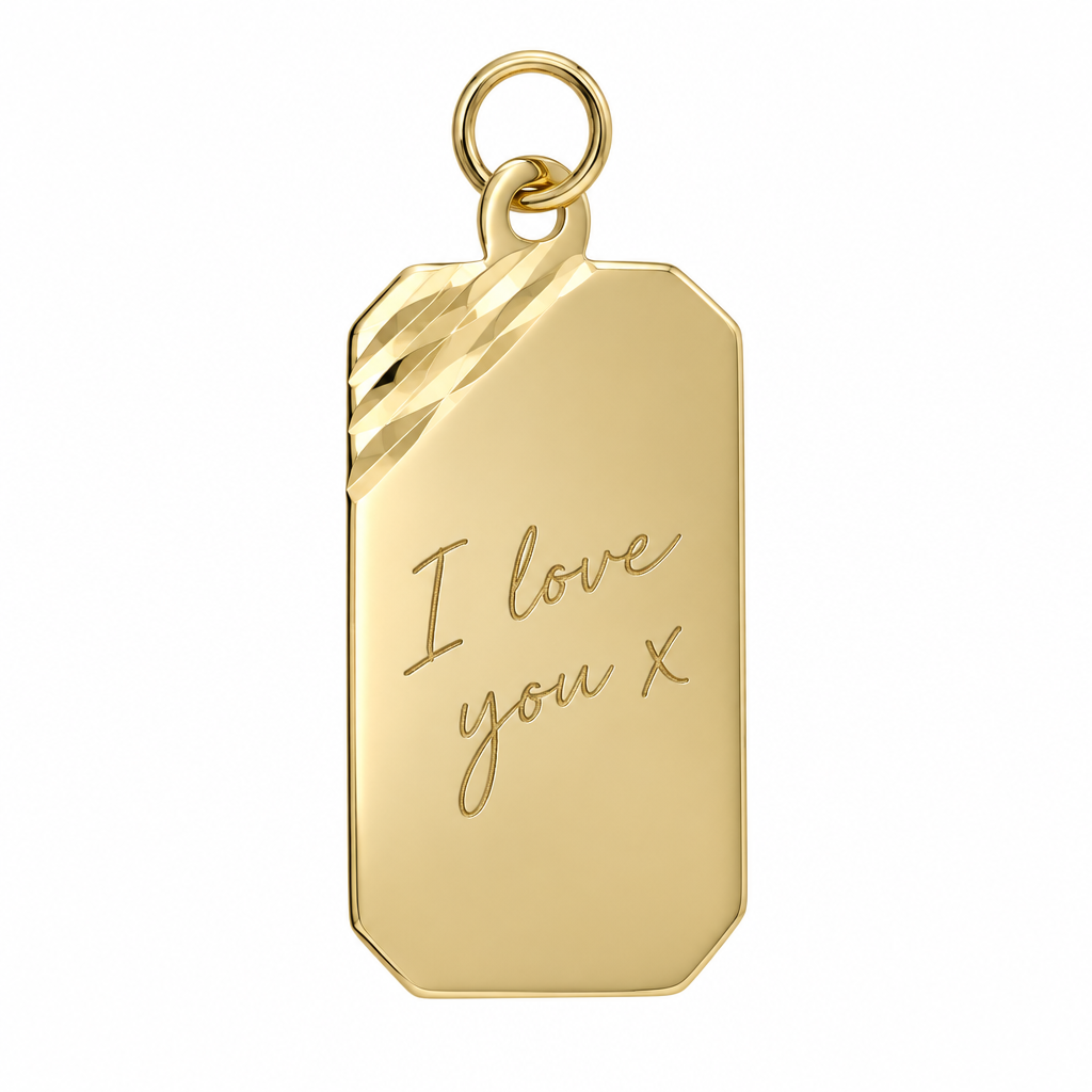 Illustrative handwriting engraving on 9ct yellow gold diamond-cut rectangular pendant alone on white