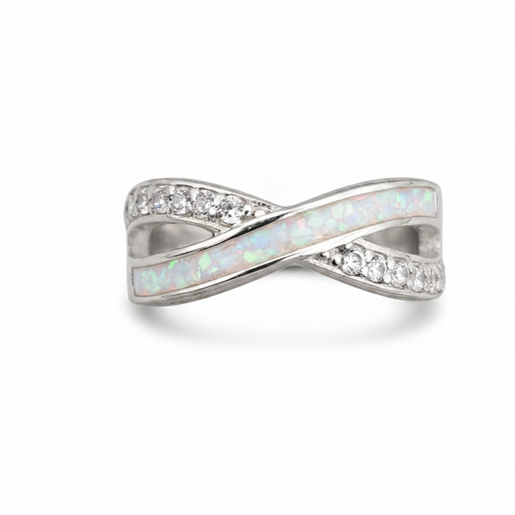 Infinity wave CZ 925 silver ring with white pearl opal resin in central channel on white background