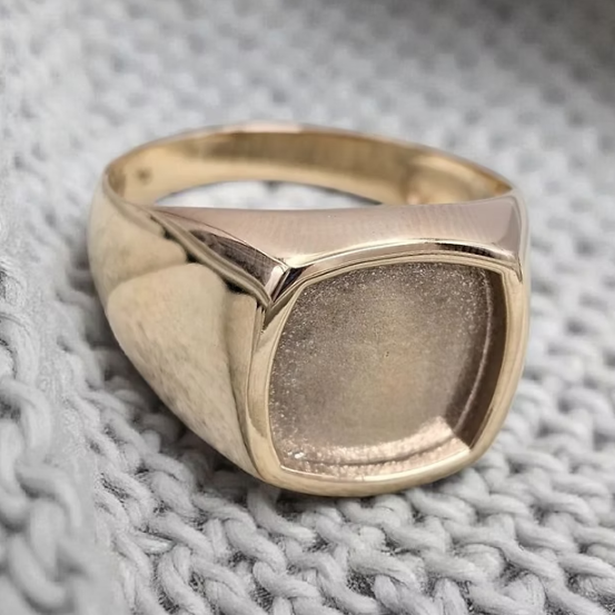 9ct yellow gold unisex square signet ring angled view on grey knit fabric