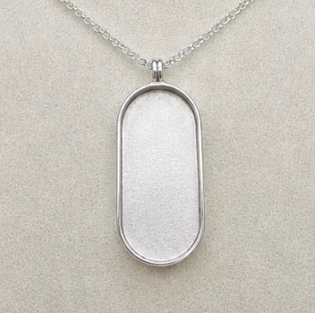 925 sterling silver oval dog tag pendant close-up showing deep resin bezel recess and polished bezel edge