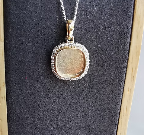 9ct rose gold CZ cushion pendant on chain, front view showing brilliant CZ halo surrounding recessed centre bezel