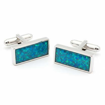 Silver 925 flat rectangular cufflinks with blue teal opal resin in 22x7mm bezel setting on white background