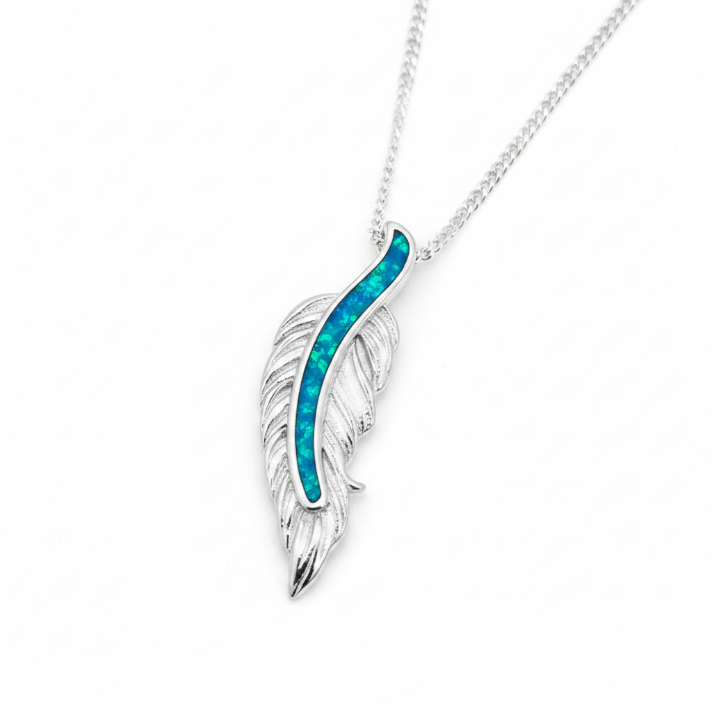Floating feather silver pendant with blue teal opal resin spine channel, white background