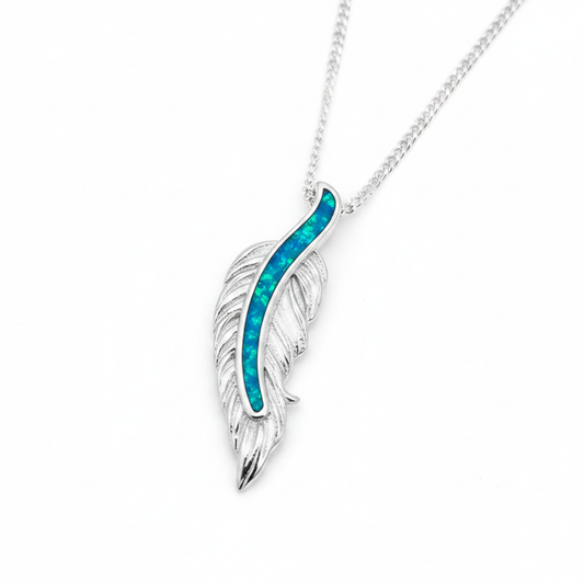 Floating feather silver pendant with blue teal opal resin spine channel, white background