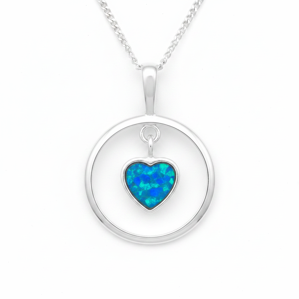 925 sterling silver circle pendant with floating heart bezel filled with blue teal opal flakes on white background