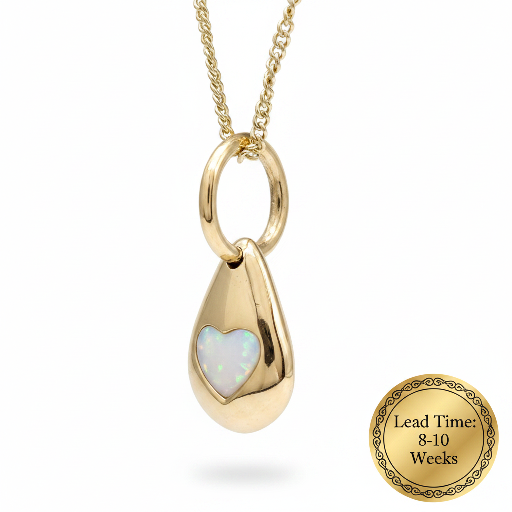 9ct gold solid 3D pebble heart pendant with white pearl opal resin heart bezel, white background, lead time 8-10 weeks sticker