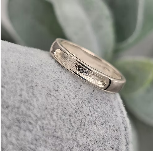 9ct white gold 4mm rounded front face channel band ring blank on stone, showing rounded rectangular recessed channel and polished curved edges