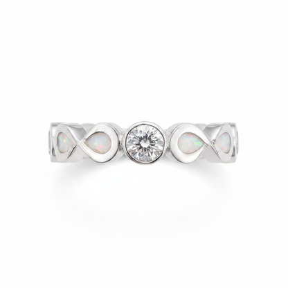 Double infinity CZ eternity 925 silver ring with white pearl opal resin in infinity bezels on white background