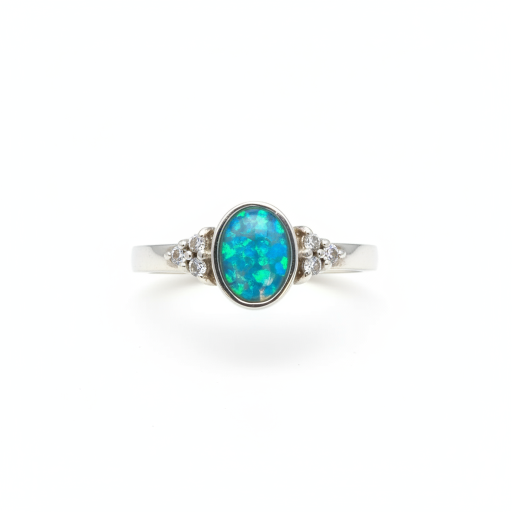 925 sterling silver oval triple CZ memorial ring with blue teal opal resin in oval bezel on white background