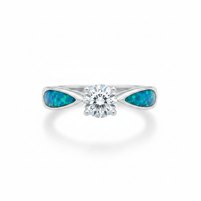 Solitaire CZ 925 silver ring with blue teal opal resin in teardrop shoulder settings on white background