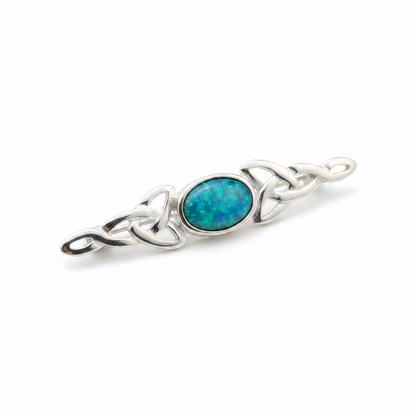 Silver 925 dainty Celtic trinity knot lapel brooch with blue teal opal resin in 7x5mm central setting on white background