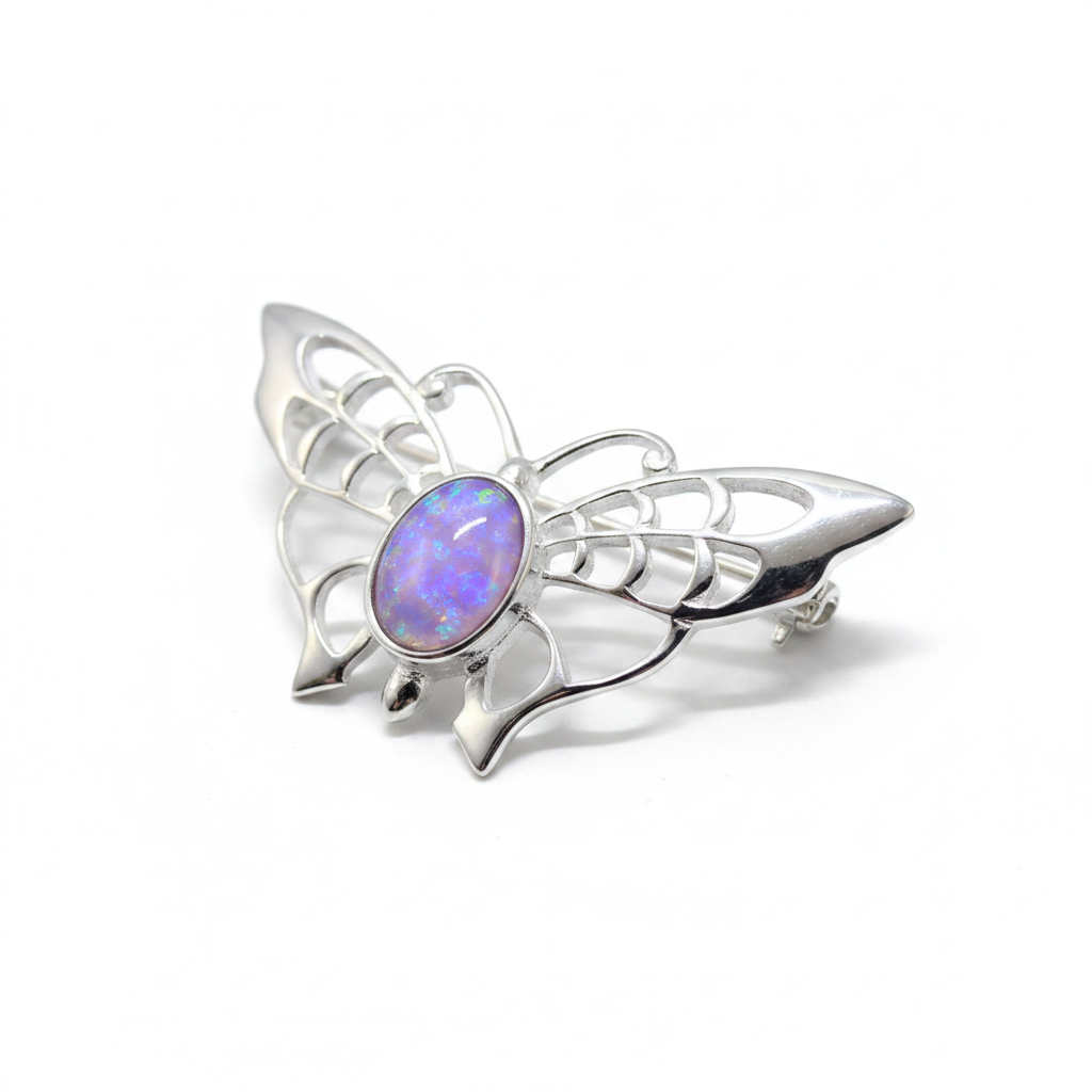 Silver 925 filigree butterfly brooch with lavender purple opal resin in 8x6mm central bezel on white background