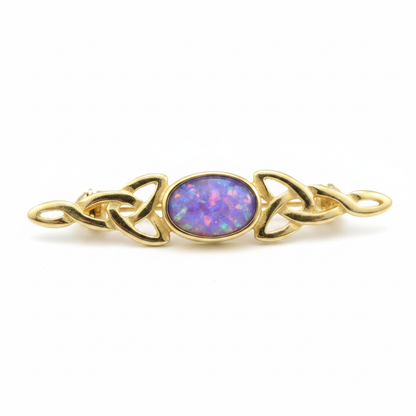 9ct gold Celtic trinity knot lapel brooch with lavender purple opal resin in 7x5mm central setting on white background