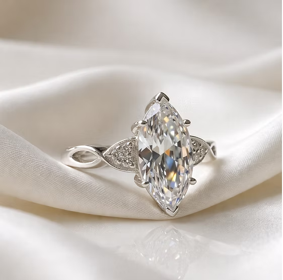 Statement marquise CZ 925 silver ring on white silk — blank silver