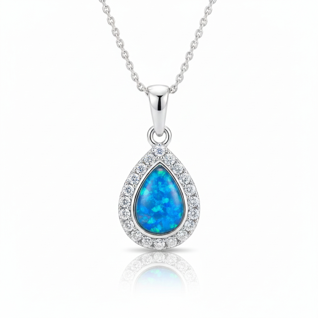 Silver 925 CZ halo teardrop memorial pendant with blue opal resin on chain, white background
