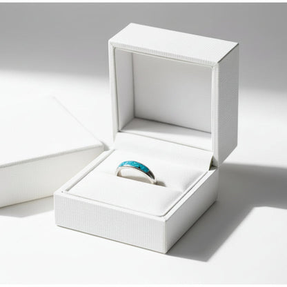 Ladies silver channel ring with opals and a small amount of memorial ashes, creating a sentimental tribute.