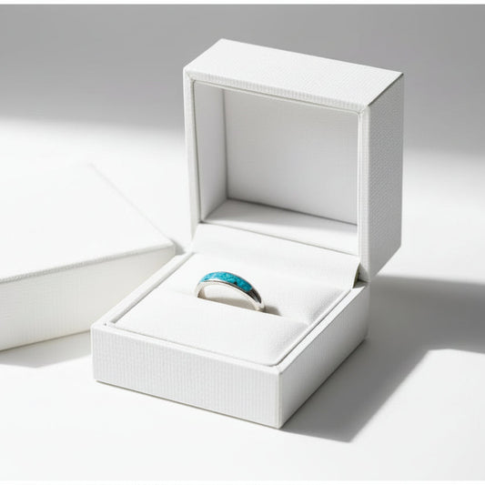 Ladies silver channel ring with opals and a small amount of memorial ashes, creating a sentimental tribute.