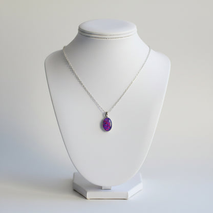 Elegant Memorial Opal Flake Oval Pendant Necklace – The pendant featuring opal flakes suspended from a sterling silver chain, designed to memorialise a loved one.