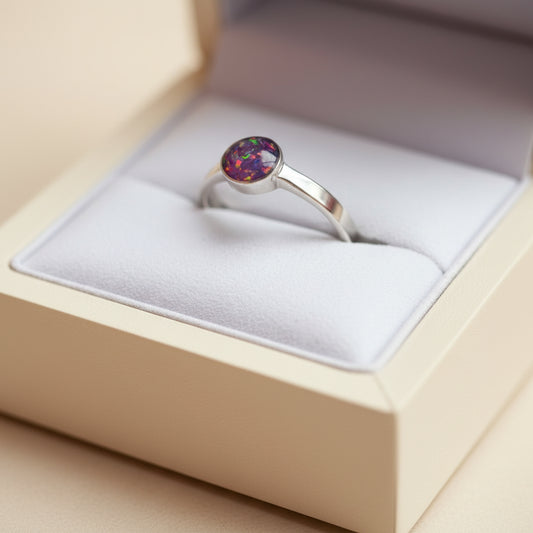 Side View of 6mm Round Memorial Ring with Opal Flakes – A side profile of the sterling silver memorial ring, showcasing the 6mm round design filled with opal flakes and sentimental items.