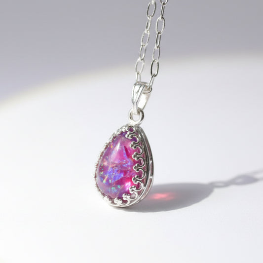 Memorial Teardrop Necklace with Ashes and Opal Flakes – A sterling silver teardrop necklace with cremation ashes and subtle opal shimmer, crafted for remembrance.

