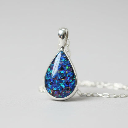 Close-up of Sterling Silver Memorial Ashes Teardrop Necklace – A delicate teardrop pendant with preserved ashes and shimmering opal flakes, set in sterling silver for a timeless keepsake.
